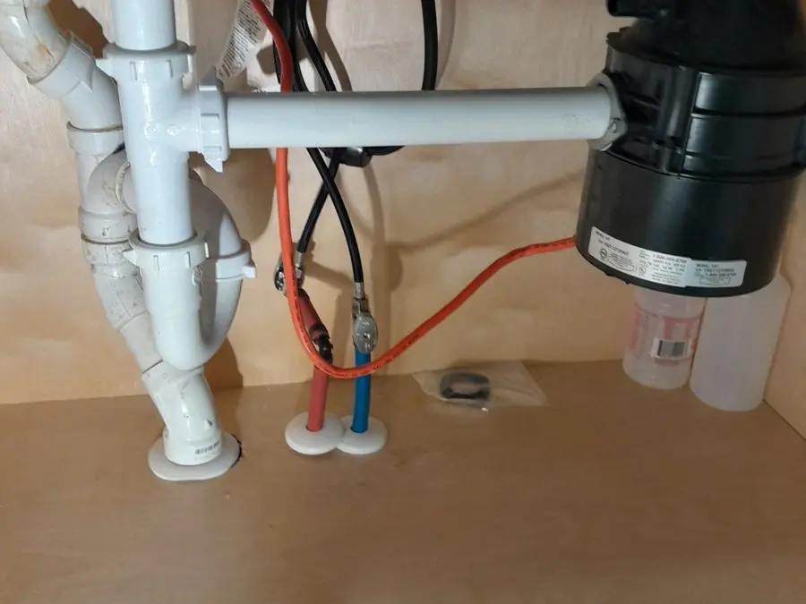 Under-sink drain and disposal plumbing